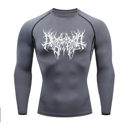 Unlock your ultimate physique with the Shadow Core Compression Rashguard. Engineered for those who embrace the dark gym aesthetic, this premium training shirt combines aggressive style with elite performance.  Why you'll love it: • Ultra-Compression Fit: